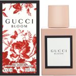 Gucci Bloom fragrance bottle and floral box design in red and white shown side by side