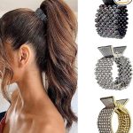 Woman with ponytail using decorative hair claw clip in 3 pack, featuring black, silver, and gold designs for elegant styling