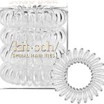 Clear spiral hair ties by Kitsch displayed in packaging with one hair tie placed separately in front