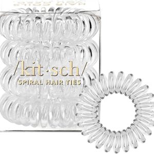 Clear spiral hair ties by Kitsch displayed in packaging with one hair tie placed separately in front