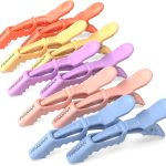 Set of colourful hair clips in pastel shades arranged in rows, ideal for hair styling and sectioning